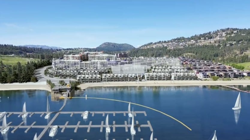 Westrich Bay tower and villas seen from Okanagan Lake with sailboats in the marina