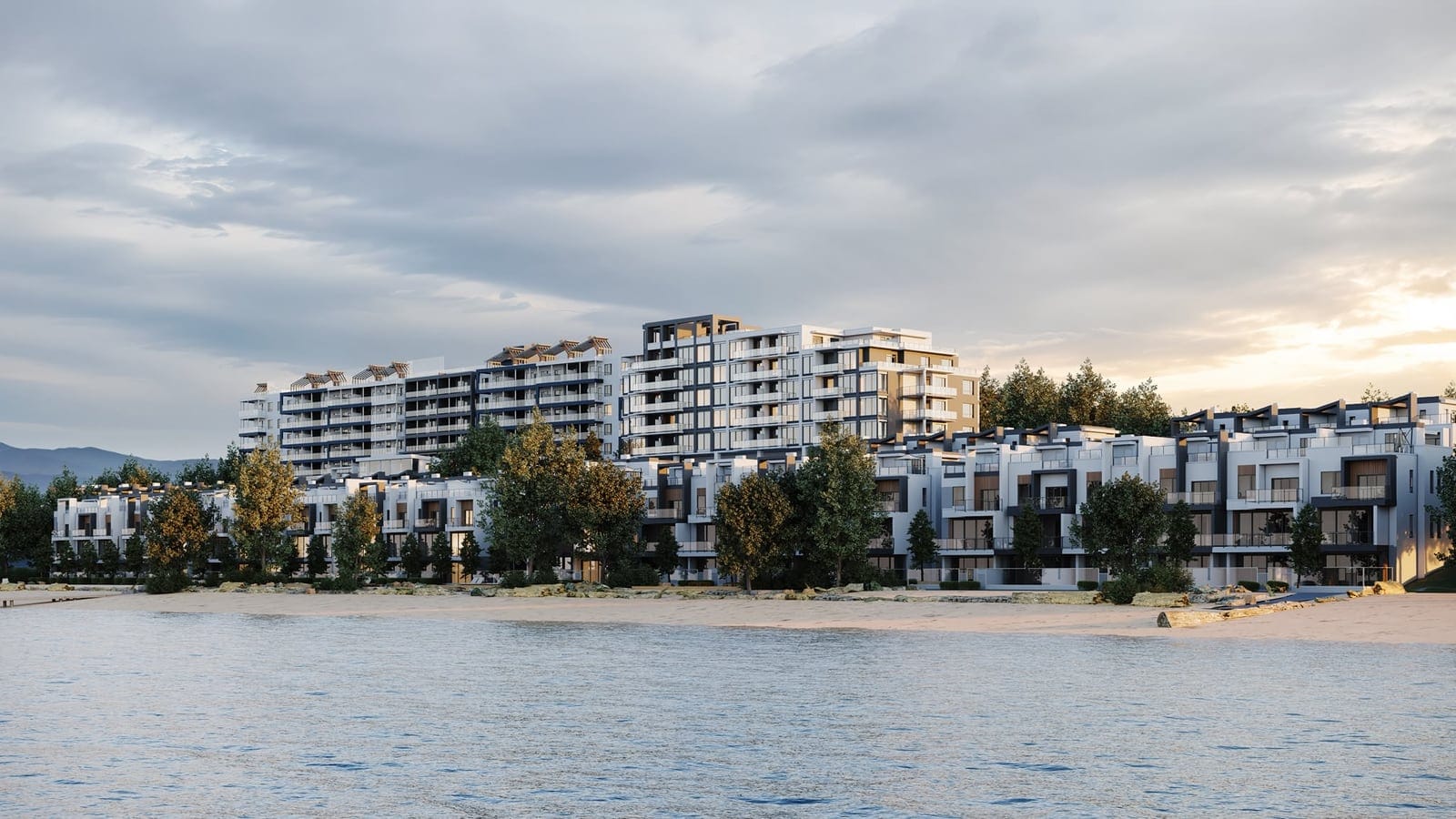 Westrich Bay from Okanagan Lake at sunset, the villas along the beach and the tower behind