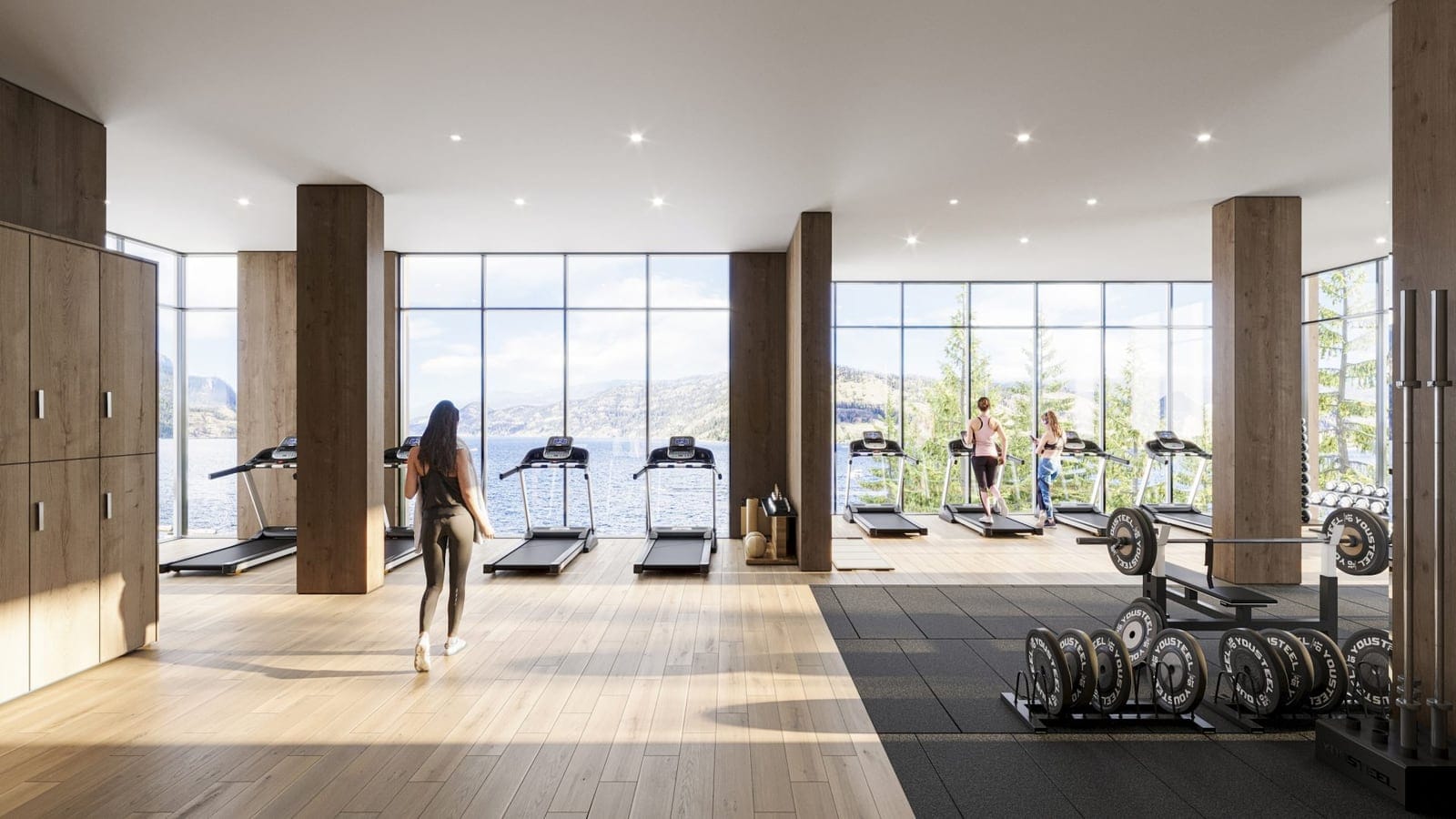 Fitness centre treadmills facing floor-to-ceiling windows and Okanagan Lake