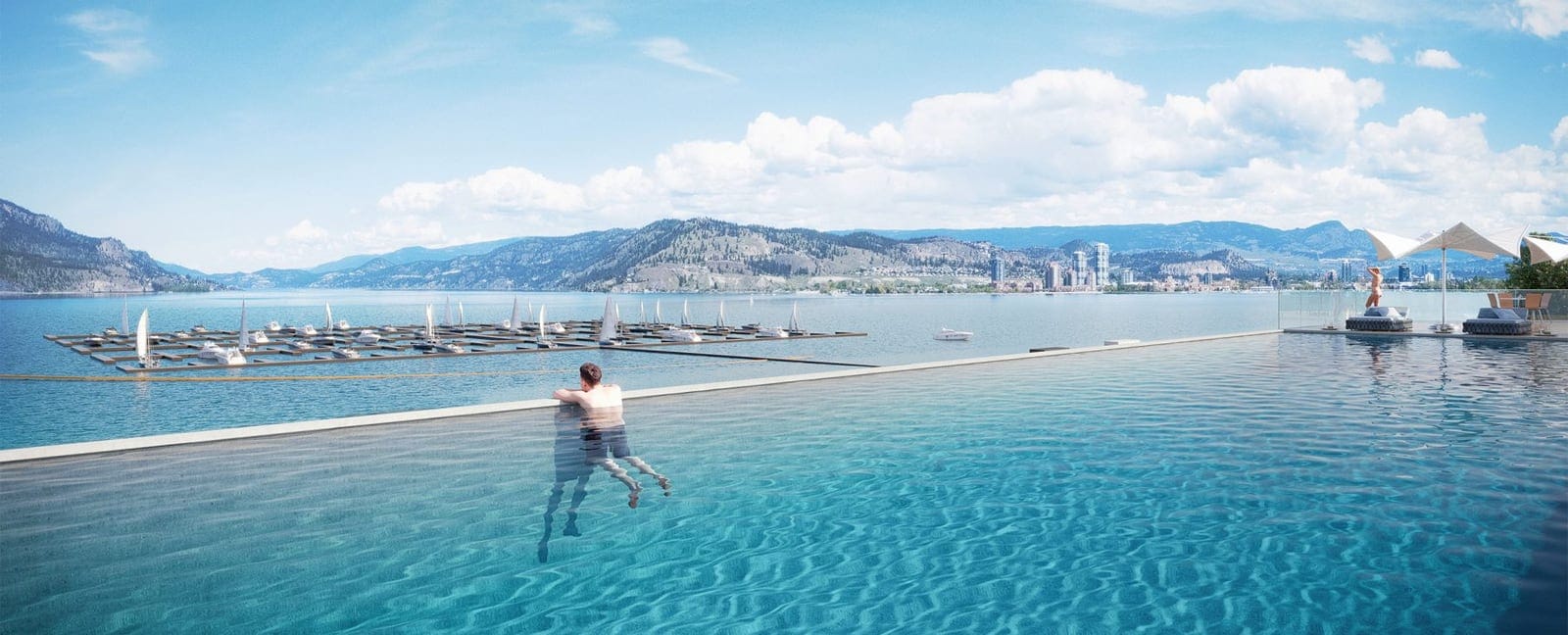 Swimmer in the infinity pool overlooking Okanagan Lake