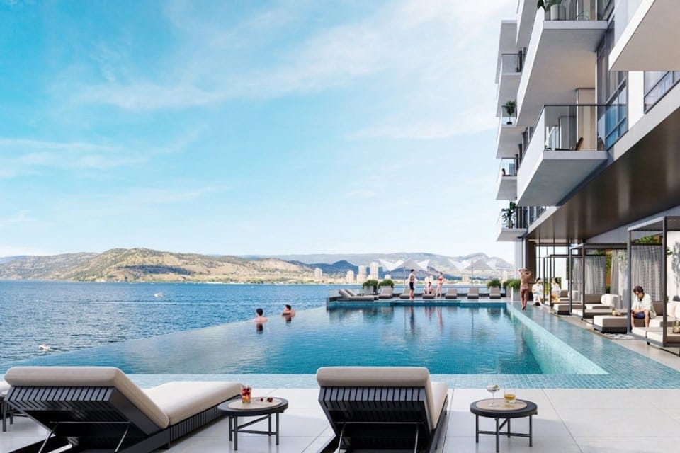 Waterfront Tower infinity pool with loungers overlooking Okanagan Lake