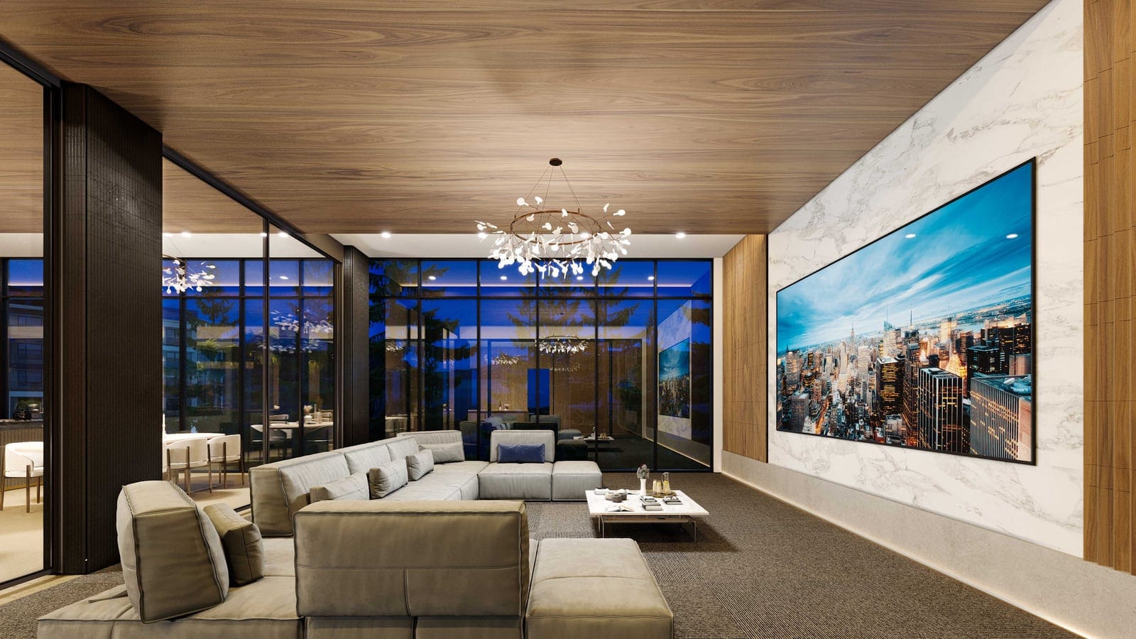 Theatre room with a large screen, sectional seating and a chandelier