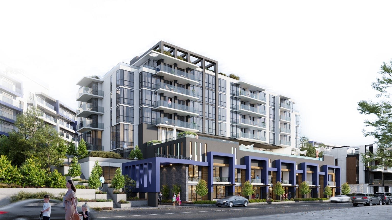 Waterfront Tower on a sunny day with townhomes along its base