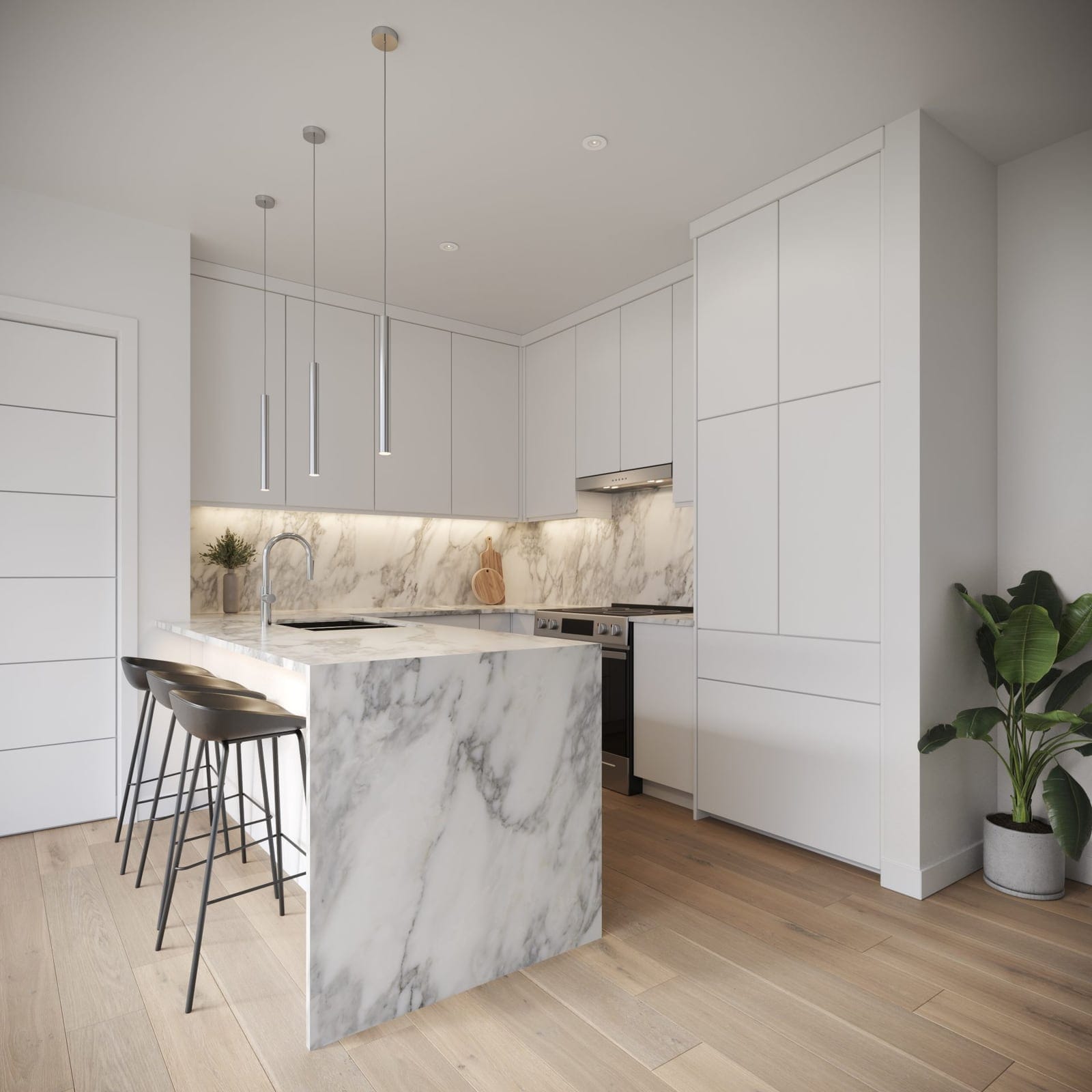 Waterfront Tower kitchen in the light colour scheme with a marble waterfall island