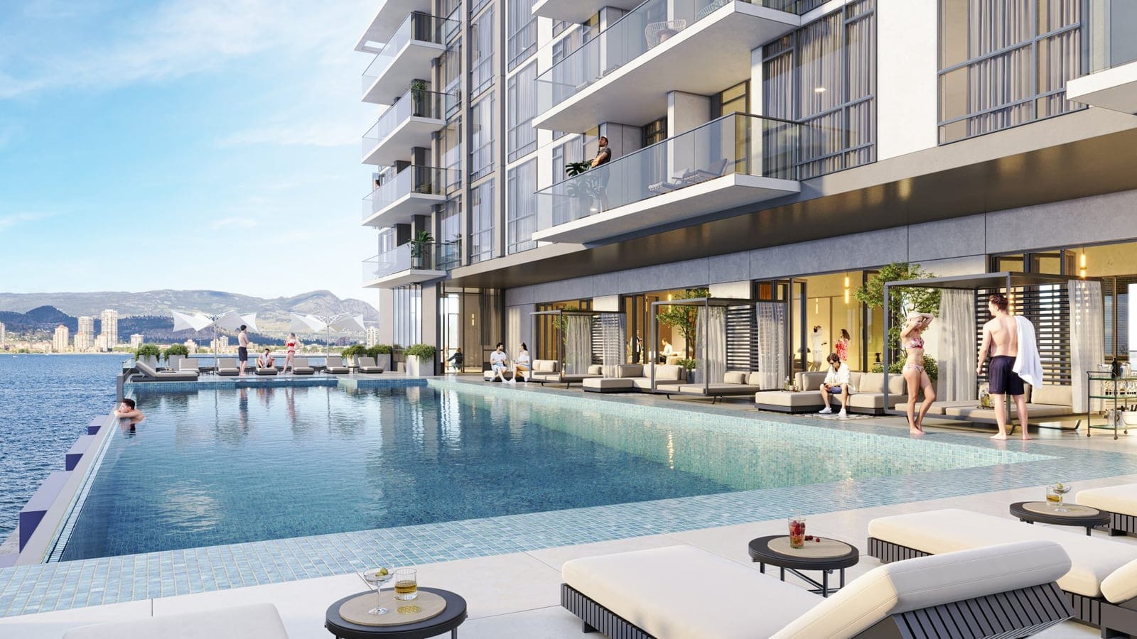 Residents at the Waterfront Tower infinity pool deck, with loungers and cabanas above Okanagan Lake