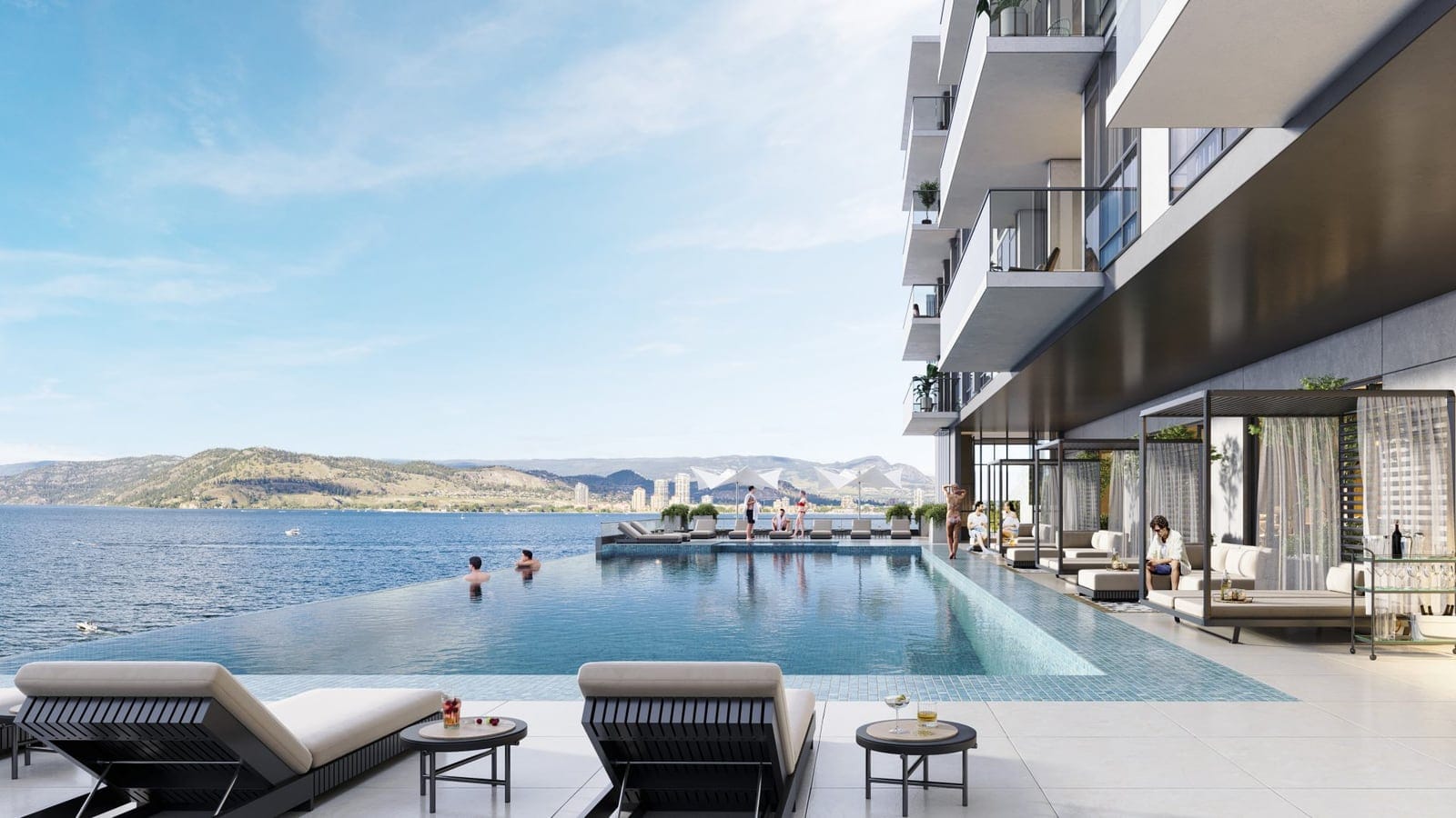 The tower's infinity pool with in-water loungers looking out over Okanagan Lake