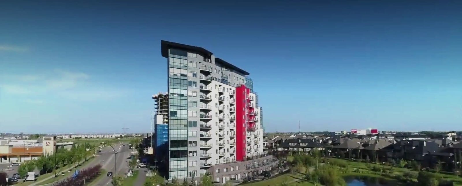 Westrich Pacific apartment building in Edmonton under a blue sky