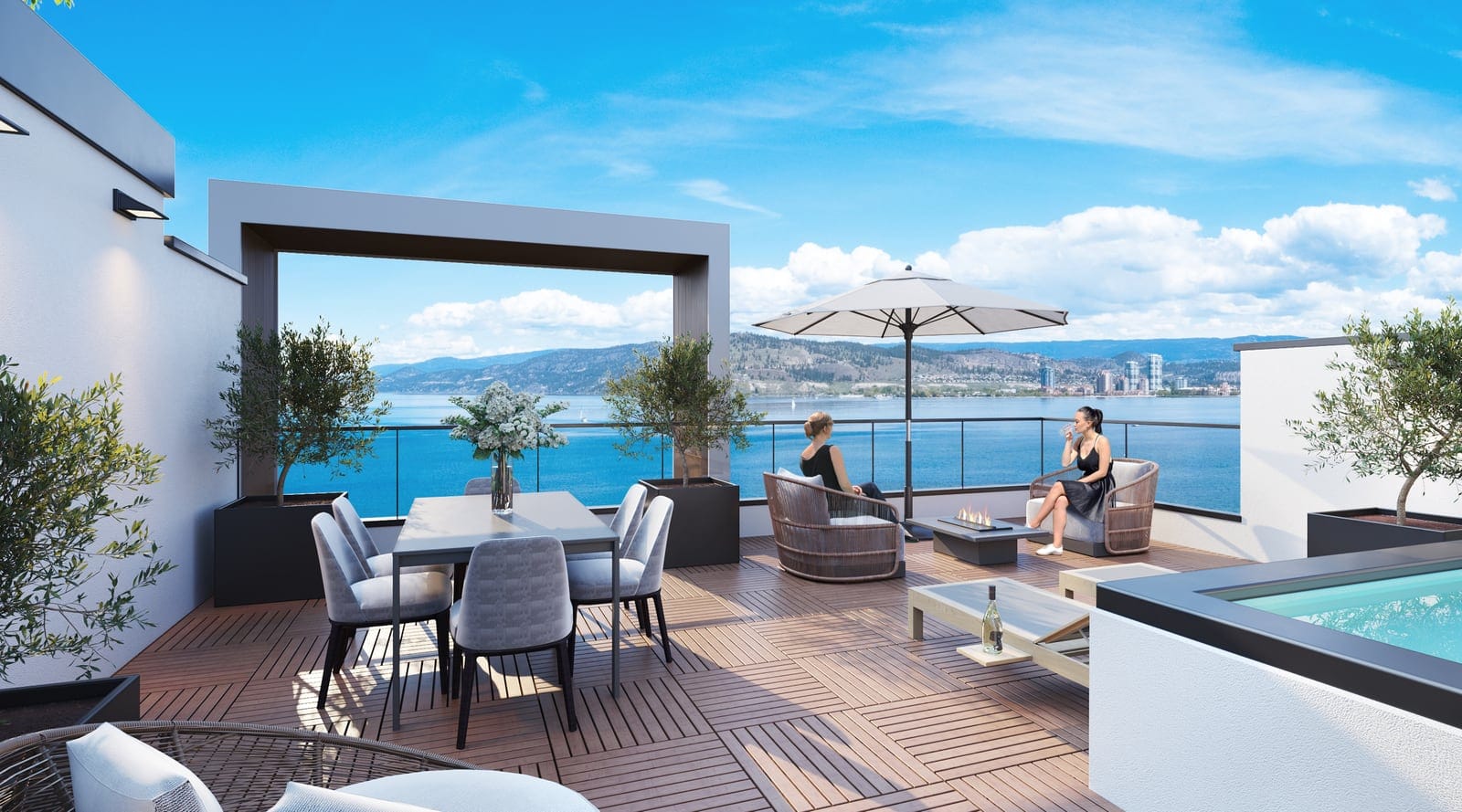 Villa rooftop deck with outdoor dining, lounge seating and a hot tub above Okanagan Lake